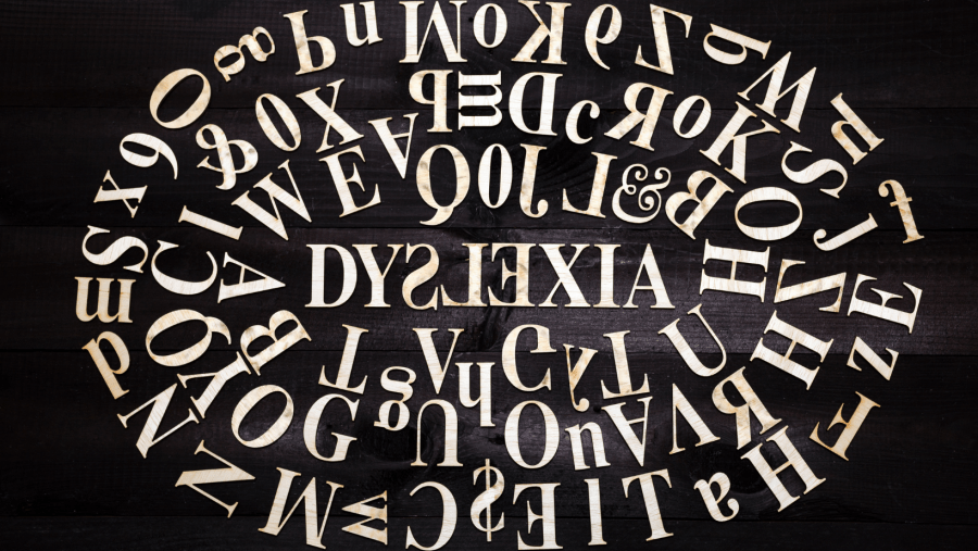 The word Dylexia surrounded by a jumble of words making it difficult to read